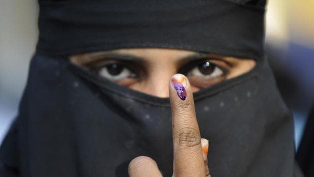 Muslim voters shows the ink mark after casting the vote at Janta Inter College in Jewar constituency of Greater Noida. Assembly elections 2017 started on Saturday with voting in 73 constituencies of western Uttar Pradesh. The region has been marred by communal violence in the last few years. (Sunil Ghosh / HT Photo )