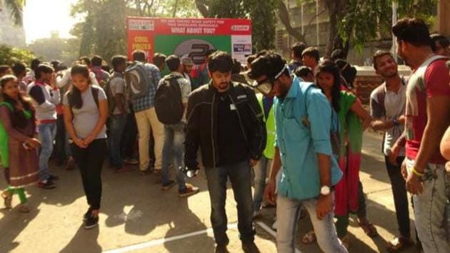 A college student wears the special goggles to experience the effect alcohol has on vision.(HT PHOTO)