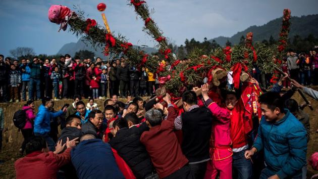 Villagers take part in the ‘beat the Buddha’ celebrations in Yuxi village. It is a time for colourful ceremonies in the coastal province, where the Hakka people have maintained folk traditions. (AFP Photo) Villagers take part in the ‘beat the Buddha’ celebrations in Yuxi village. It is a time for colourful ceremonies in the coastal province, where the Hakka people have maintained folk traditions. (AFP Photo)