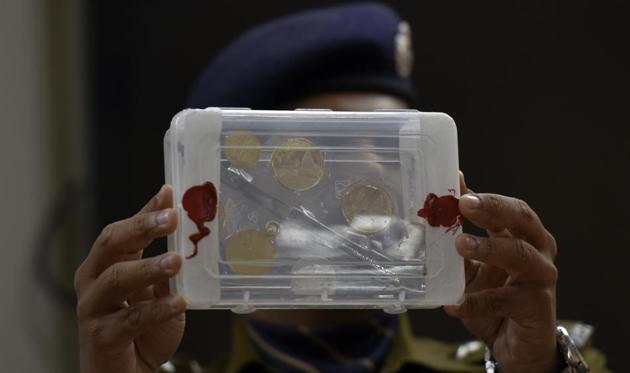 A police officer shows some medals that were stolen from the house of Nobel laureate Kailash Satyarthi. (Ravi Choudhary/HT PHOTO) A police officer shows some medals that were stolen from the house of Nobel laureate Kailash Satyarthi. (Ravi Choudhary/HT PHOTO)