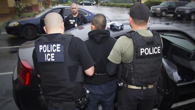 This image obtained February 11, 2017 courtesy of the Immigration and Customs Enforcement (ICE) shows US Immigration and Customs Enforcement officers detaining a suspect during an enforcement operation on February 7, 2017 in Los Angeles, California. (AFP) This image obtained February 11, 2017 courtesy of the Immigration and Customs Enforcement (ICE) shows US Immigration and Customs Enforcement officers detaining a suspect during an enforcement operation on February 7, 2017 in Los Angeles, California. (AFP)