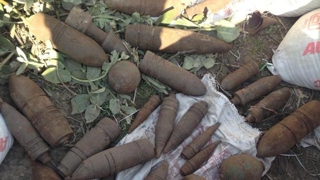 Unexploded shells and hand grenades recovered by police near Alamgir village on Monday. (HT Photo) Unexploded shells and hand grenades recovered by police near Alamgir village on Monday. (HT Photo)