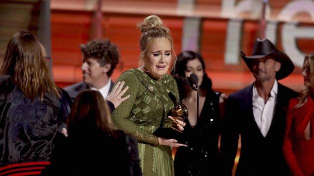 Adele accepts the Grammy for Record of the Year for Hello at the 59th Annual Grammy Awards in Los Angeles.(AP)