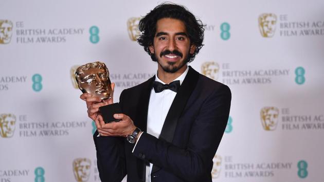 Dev Patel poses with the award for a Supporting Actor for his work on the film Lion at the BAFTA British Academy Film Awards at the Royal Albert Hall in London on Monday. (AFP)
