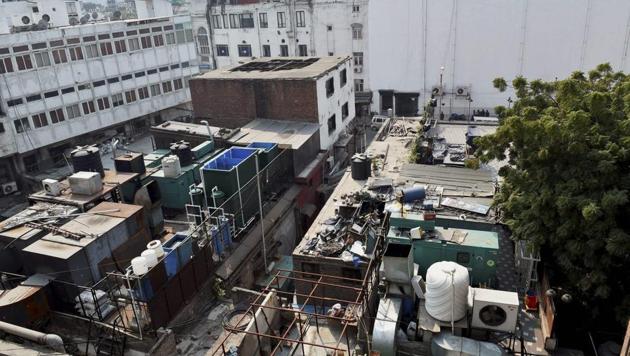 A view of buildings in Connaught Place. The NDMC is carrying out a two-day survey of all the 13 blocks to identify dangerous constructions. (PTI FILE) A view of buildings in Connaught Place. The NDMC is carrying out a two-day survey of all the 13 blocks to identify dangerous constructions. (PTI FILE)
