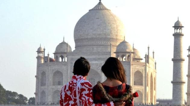A couple near the historic Taj Mahal on the eve of Valentine's Day in Agra.(PTI Photo) A couple near the historic Taj Mahal on the eve of Valentine's Day in Agra.(PTI Photo)
