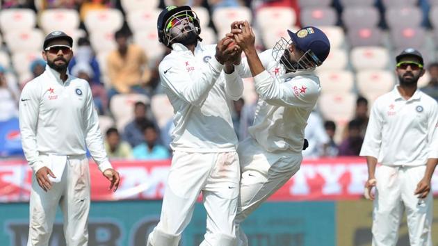 India's K.Rahul (L) and Murali Vijay try to catch the ball off the wicket of Bangladesh's Taijul Islam. (AFP) 