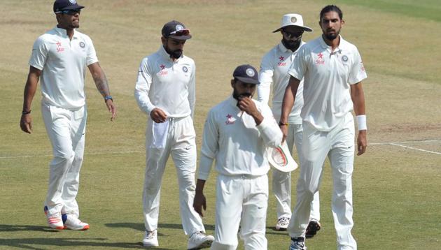 Virat Kohli (2L) and Indian teammates after winning the one-off Test against Bangladesh in Hyderabad.(AFP)