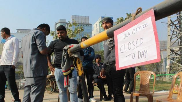 Bouncers outside the Ola office in Gurgaon on Monday.(Parveen Kumar/HT Photo) Bouncers outside the Ola office in Gurgaon on Monday.(Parveen Kumar/HT Photo)