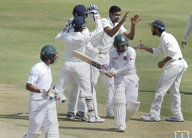 India cricket team’s Ravichandran Ashwin celebrates his 250th Test wicket with teammates after dismissing Bangladesh cricket team skipper Mushfiqur Rahim.(PTI)