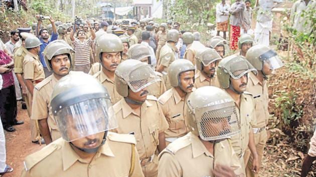 Police keep a vigil after violence in Kannur, India.(HT Photo)