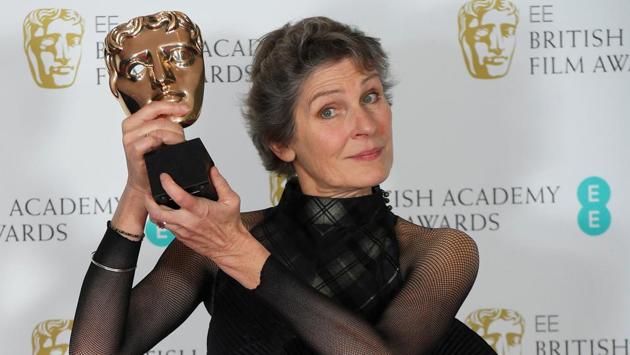 Madeline Fontaine holds the award for Costume Design, Jackie. (REUTERS)