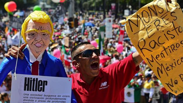 Thousands take part in an anti-Trump march in Mexico City, on February 12, 2017. Mexicans took to the streets against US President Donald Trump, hitting back at his anti-Mexican rhetoric and vows to make the country pay for his "big, beautiful" border wall. (AFP File) Thousands take part in an anti-Trump march in Mexico City, on February 12, 2017. Mexicans took to the streets against US President Donald Trump, hitting back at his anti-Mexican rhetoric and vows to make the country pay for his "big, beautiful" border wall. (AFP File)