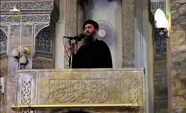 A man purported to be the reclusive leader of the militant Islamic State Abu Bakr al-Baghdadi making what would have been his first public appearance, at a mosque in the centre of Iraq’s second city, Mosul, according to a video recording posted on the Internet on July 5, 2014. An al-Qaeda leader accuses IS leader Abu Bakr al-Baghdadi of slandering his group.(Reuters/ Social media website) A man purported to be the reclusive leader of the militant Islamic State Abu Bakr al-Baghdadi making what would have been his first public appearance, at a mosque in the centre of Iraq’s second city, Mosul, according to a video recording posted on the Internet on July 5, 2014. An al-Qaeda leader accuses IS leader Abu Bakr al-Baghdadi of slandering his group.(Reuters/ Social media website)