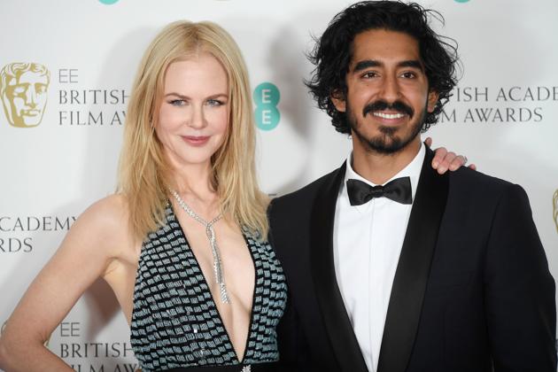 Presenters Nicole Kidman and Dev Patel pose after presenting the awards. (REUTERS)