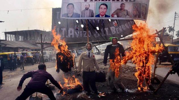 Protesters burn effigy of Nagaland chief minister TR Zeliang, home minister Y Patton, NPF president Shürhozelie and Nagaland IRB personnel during a protest against killing of two youth by security personnel last month in Dimapur. (PTI File Photo) Protesters burn effigy of Nagaland chief minister TR Zeliang, home minister Y Patton, NPF president Shürhozelie and Nagaland IRB personnel during a protest against killing of two youth by security personnel last month in Dimapur. (PTI File Photo)