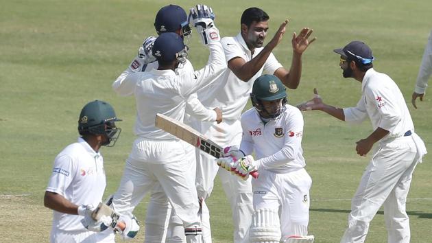 India's Ravichandran Ashwin, center without cap, celebrates with teammates the dismissal of Bangladesh's captain Mushfiqur Rahim. (AP) 