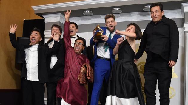 The Silk Road Ensemble pose in the press room with the Best World Music Album Grammy, for Sing Me Home, during the 59th Annual Grammy music Awards on February 12, 2017, in Los Angeles, California. / AFP PHOTO / Robyn BECK (AFP) The Silk Road Ensemble pose in the press room with the Best World Music Album Grammy, for Sing Me Home, during the 59th Annual Grammy music Awards on February 12, 2017, in Los Angeles, California. / AFP PHOTO / Robyn BECK (AFP)