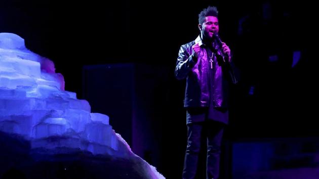 The Weeknd and Daft Punk perform at the awards gala. (AP)
