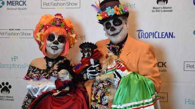 Danny and Amy Cox, representing Mexico in the World Fashion Presents segment pose during the 14th Annual New York Pet Fashion Show (TIMOTHY A. CLARY / AFP)