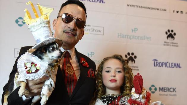 Anthony Rubio and Bridilla, representing England and contestants in the World Fashion Presents segment of the 14th Annual New York Pet Fashion Show (TIMOTHY A. CLARY / AFP)