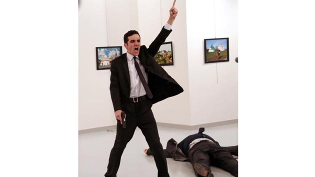 Spot News, first prize, stories: Mevlut Mert Altintas shouts after shooting Russian ambassador to Turkey Andrei Karlov, at an art gallery in Ankara, Turkey on December 19, 2016. (Burhan Ozbilici/AP Photo)