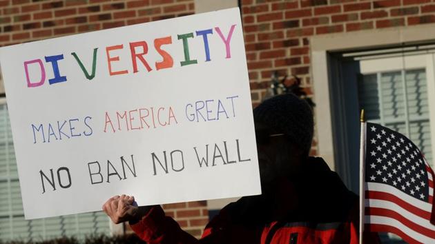 A man protests outside of Republican Rep. Mike Bishop's office on February 13, 2017 in Brighton, Michigan. (AFP) A man protests outside of Republican Rep. Mike Bishop's office on February 13, 2017 in Brighton, Michigan. (AFP)