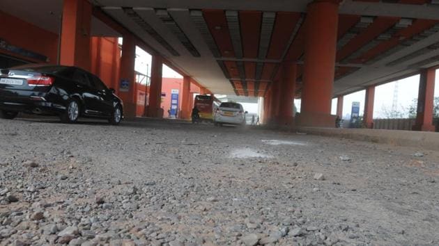 A 200-metre patch of a circular road in DLF Cyber City near the Moulsari Avenue Metro station is riddled with potholes, causing problems for commuters moving towards the NH-8. (Parveen Kumar/HT Photo) A 200-metre patch of a circular road in DLF Cyber City near the Moulsari Avenue Metro station is riddled with potholes, causing problems for commuters moving towards the NH-8. (Parveen Kumar/HT Photo)