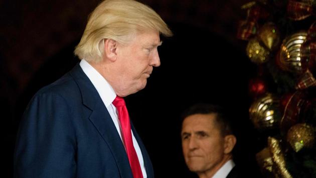 File photo of US President Donald Trump  with National Security Adviser Michael Flynn at Mar-a-Lago in Palm Beach, Florida, in December 2016. (AFP)
