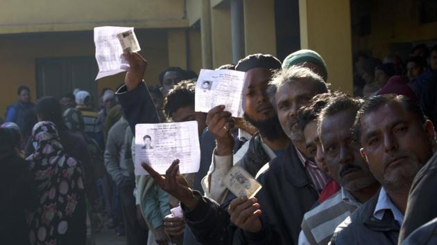 Voters show their identity card as they wait in a queue to cast their votes at Muradnagar, Uttar Pradesh, Saturday, Feb. 11, 2017. (AP) Voters show their identity card as they wait in a queue to cast their votes at Muradnagar, Uttar Pradesh, Saturday, Feb. 11, 2017. (AP)