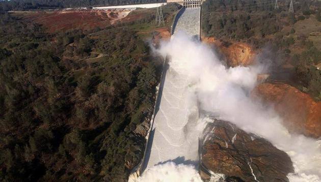 A damaged spillway with eroded hillside is seen in an aerial photo taken over the Oroville Dam in Oroville, California, US.(REUTERS) A damaged spillway with eroded hillside is seen in an aerial photo taken over the Oroville Dam in Oroville, California, US.(REUTERS)