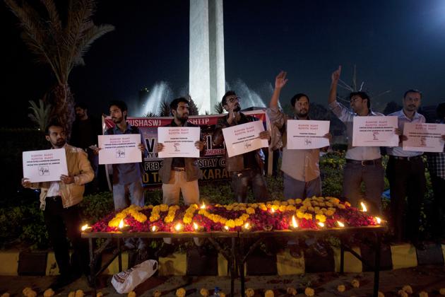 Karachi residents on Tuesday hold a candlelight vigil for the victims of the Lahore blast. (AP) Karachi residents on Tuesday hold a candlelight vigil for the victims of the Lahore blast. (AP)