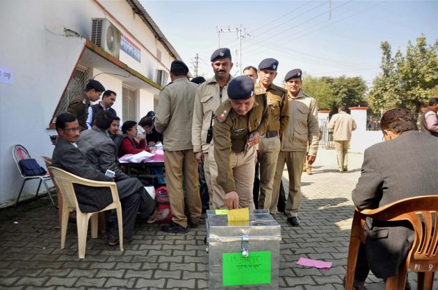 A police officer votes using postal ballot in Dehradun on Saturday. (PTI File) A police officer votes using postal ballot in Dehradun on Saturday. (PTI File)