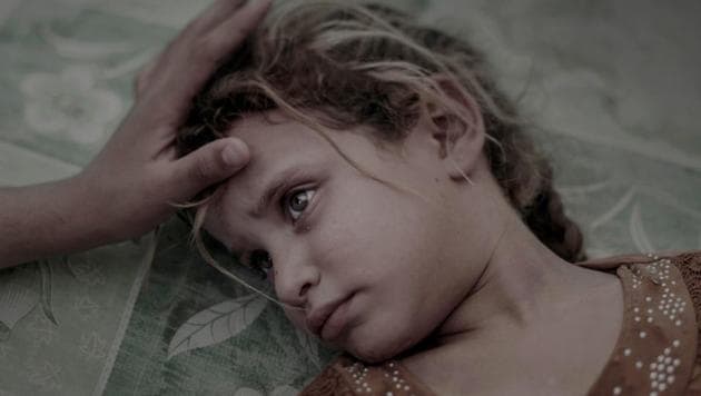 People, first prize: Five-year-old Maha and her family fled from the village Hawija outside Mosul, Iraq. Now Maha lays on a dirty mattress in the overcrowded transit center in Debaga’s refugee camp (Magnus Wennman)