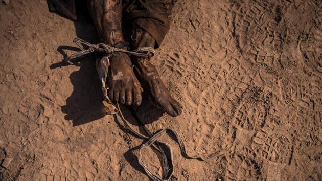 General News, second prize: A tied, decomposed body is seen at the site of a mass grave that was discovered on the outskirts of Hamam al-Alil, Iraq. (Sergey Ponomarev for the New York Times)