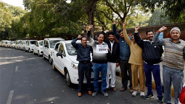 Ola and Uber taxi drivers shout slogans on the fifth day of their strike against withdrawal of incentives by the app-based cab aggregators, at Jantar Mantar in New Delhi on Tuesday. (PTI Photo) Ola and Uber taxi drivers shout slogans on the fifth day of their strike against withdrawal of incentives by the app-based cab aggregators, at Jantar Mantar in New Delhi on Tuesday. (PTI Photo)