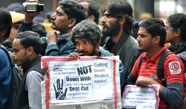 JNU students and teachers hold placards during a protest on Tuesday against seat cut. The protest march taken out from Mandi House to Jantar Mantar. (Zuhaib Mohammad/HT Photo) JNU students and teachers hold placards during a protest on Tuesday against seat cut. The protest march taken out from Mandi House to Jantar Mantar. (Zuhaib Mohammad/HT Photo)