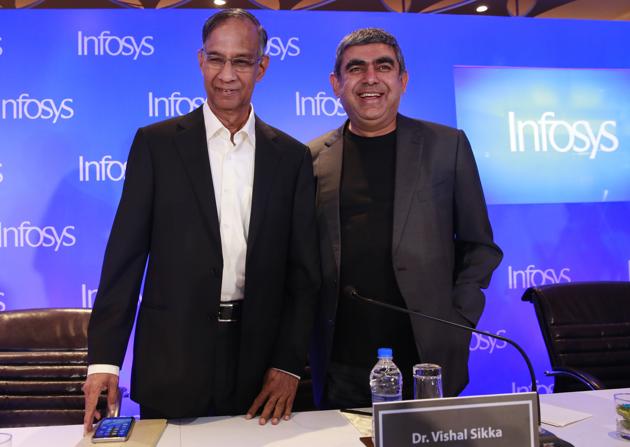 Infosys Chief Executive Officer Vishal Sikka, along with Chairman of the Board R Seshasayee, left, arrives to address a press conference in Mumbai.(AP)