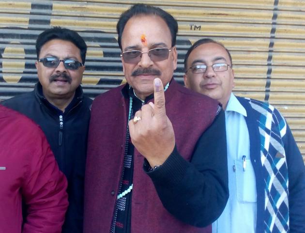 State BJP president Ajay Bhatt poses after casting vote in Ranikhet.(HT PHOTO)