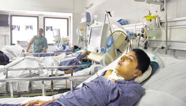 Rohit Kumar, 14, has been admitted to the AIIMS neurosurgery ward for over a year because he requires ventilator support which his family cannot afford at home.(Saumya Khandelwal/HT Photo)