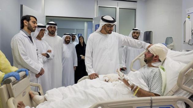 In this Saturday, Jan. 14, 2017, file photo released by Emirates News Agency, WAM, Sheikh Mohamed bin Zayed Al Nahyan Crown Prince of Abu Dhabi and Deputy Supreme Commander of the UAE Armed Forces, visits Juma Al Kaabi, the UAE Ambassador to Afghanistan, who was injured in the Kandahar terrorist attack at Al Mafraq hospital in Abu Dhabi, United Arab Emirates.(AP Photo)