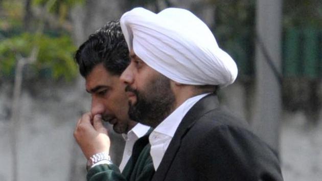 Shera Singh (right) and Deep Sidhu (rubbing his nose), friends of Akansh Sen, were called for questioning at the Sector-3 police station on Tuesday.(Ravi Kumar/Hindustan Times)