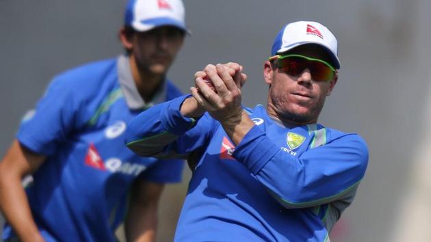 Australia's David catches a ball as Mitchell Starc looks on during their training in Mumbai on Wednesday.(REUTERS) Australia's David catches a ball as Mitchell Starc looks on during their training in Mumbai on Wednesday.(REUTERS)