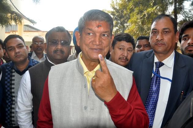 Chief minister Harish Rawat poses for shutterbugs outside a polling booth in Dehadun on Wednesday. (Vinay Santosh Kumar) Chief minister Harish Rawat poses for shutterbugs outside a polling booth in Dehadun on Wednesday. (Vinay Santosh Kumar)