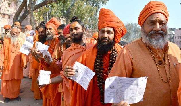Sadhus wait for their turn to vote at a polling booth in Haridwar on Wednesday. (ht photo) Sadhus wait for their turn to vote at a polling booth in Haridwar on Wednesday. (ht photo)