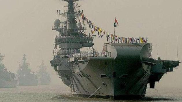 Indian Navy's aircraft carrier INS Viraat seen with other ships during a fleet review in Mumbai.(HT File)