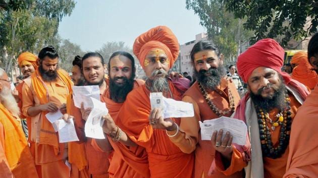 Spiritual gurus stand in line to cast their vote during Uttarakhand assembly election, in Haridwar. (PTI Photo) Spiritual gurus stand in line to cast their vote during Uttarakhand assembly election, in Haridwar. (PTI Photo)
