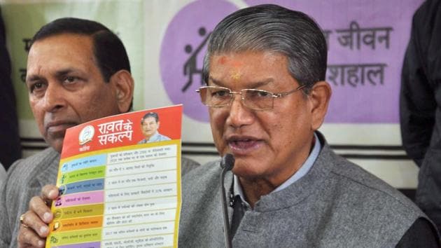 Uttrakhand chief minister Harish Rawat with former Delhi state minister Rajkumar Chauhan releasing 'Rawat Kay Sankalp' at party office in Dehradun. (PTI File Photo) Uttrakhand chief minister Harish Rawat with former Delhi state minister Rajkumar Chauhan releasing 'Rawat Kay Sankalp' at party office in Dehradun. (PTI File Photo)