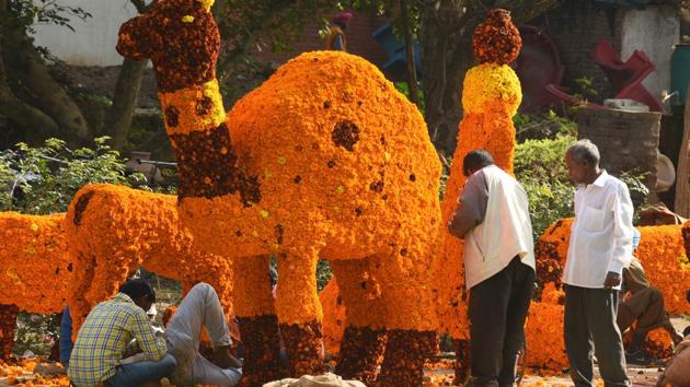 People at work ahead of the rose festival in Chandigarh.  (Sanjeev Sharma/HT Photo) 