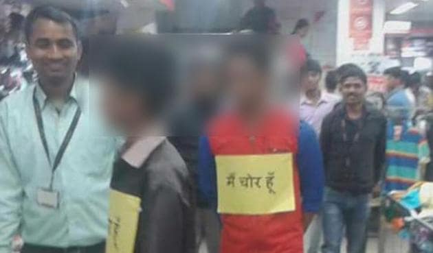 A photo of suspected child shoplifters being paraded with placards around their neck at a posh mall in Darbhanga has gone viral on social media.(WhatsApp grab)
